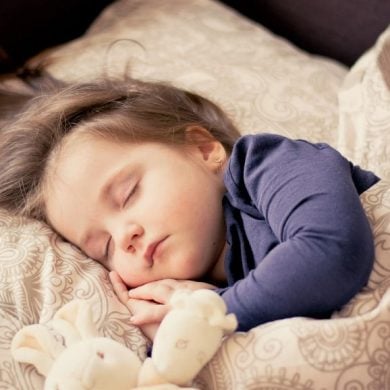 This shows a sleeping little girl