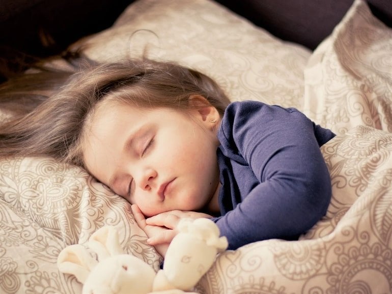 This shows a sleeping little girl