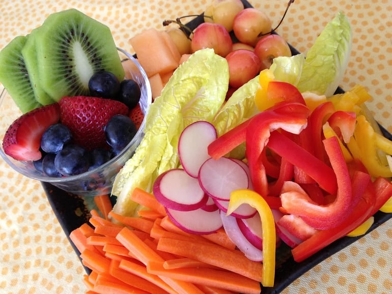 This shows a fruit and veggie salad plate
