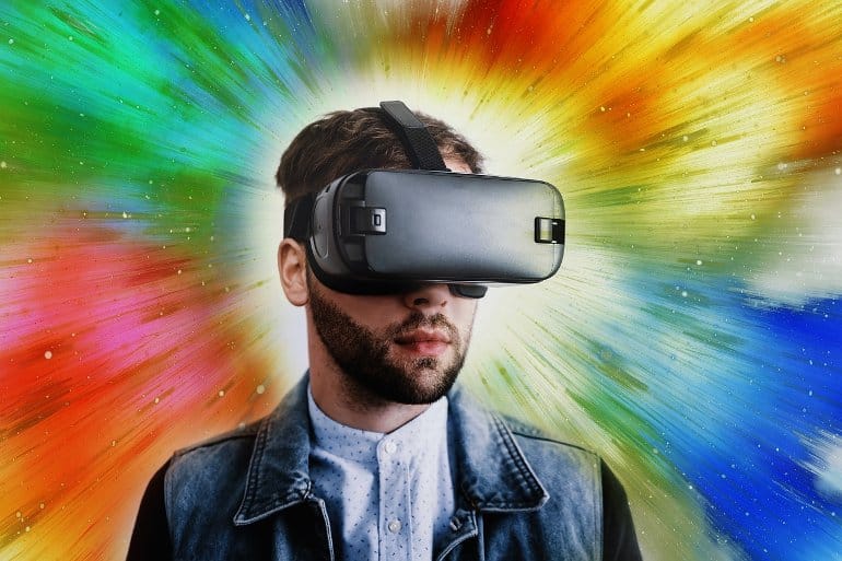 This shows a man wearing VR goggles