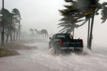 This shows a truck driving in a hurricane