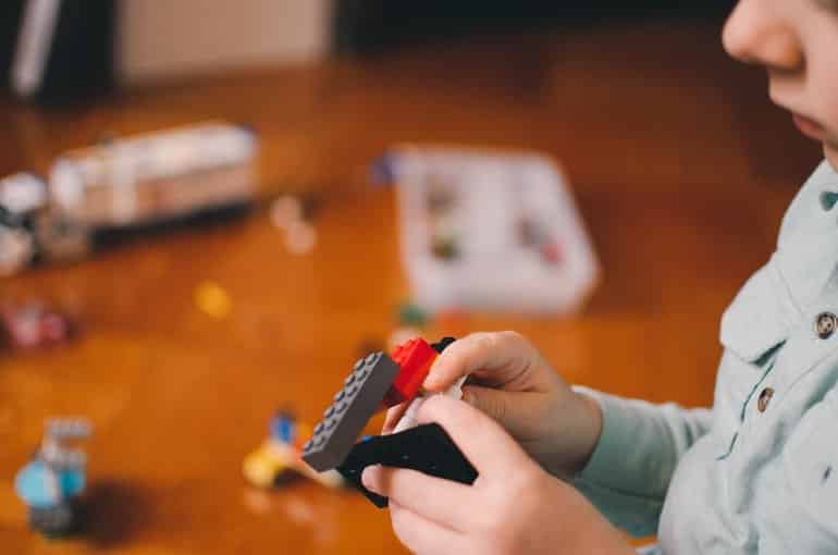 This shows a child playing with blocks