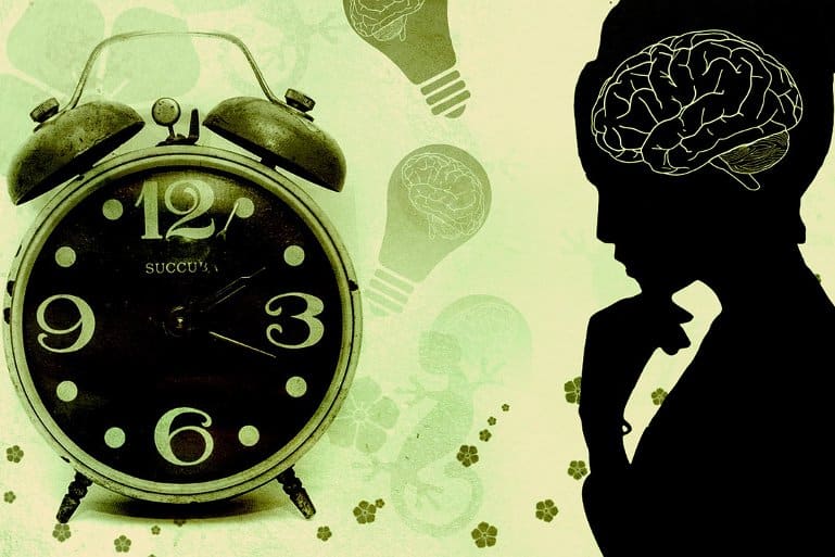 This shows an alarm clock and the outline of a woman and a brain