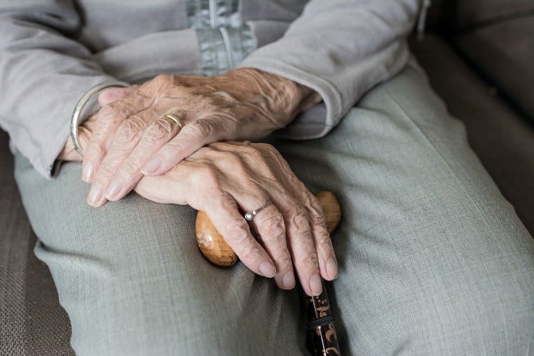 This shows an old lady's hands