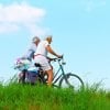 This shows an older couple riding bicycles