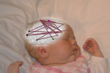 This shows a photo of a sleeping baby