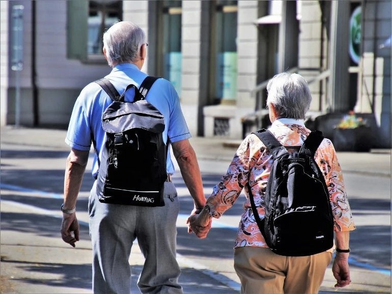 This shows an older couple walking