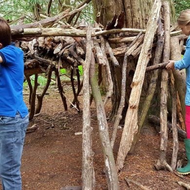 This shows children building a fort