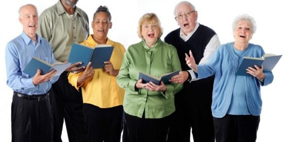 This shows a group of people singing