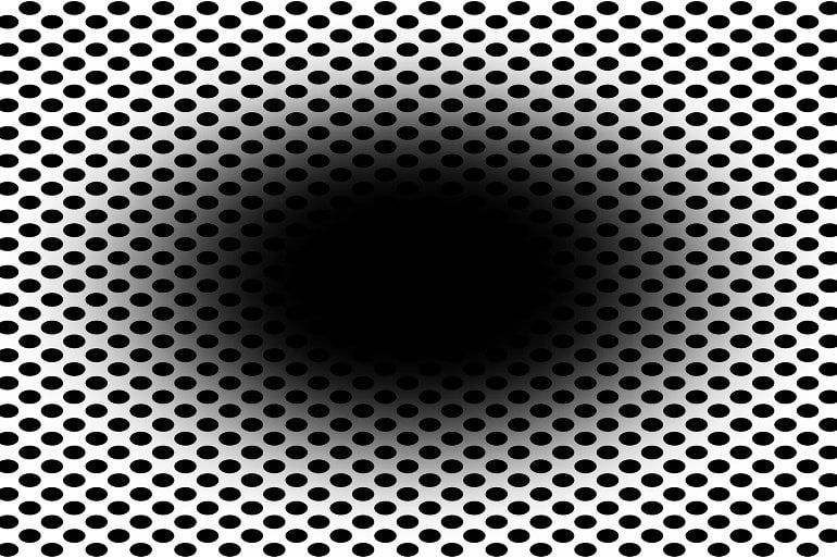 This shows a large black hole surrounded by small black dots on a white background