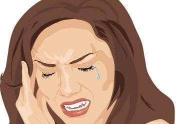 This is a cartoon of a woman holding her head in pain and crying