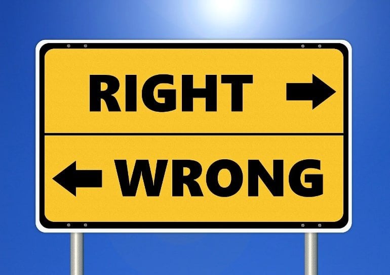 This shows a sign with arrows pointing to the "right" and "wrong" ways