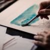 This shows a person painting