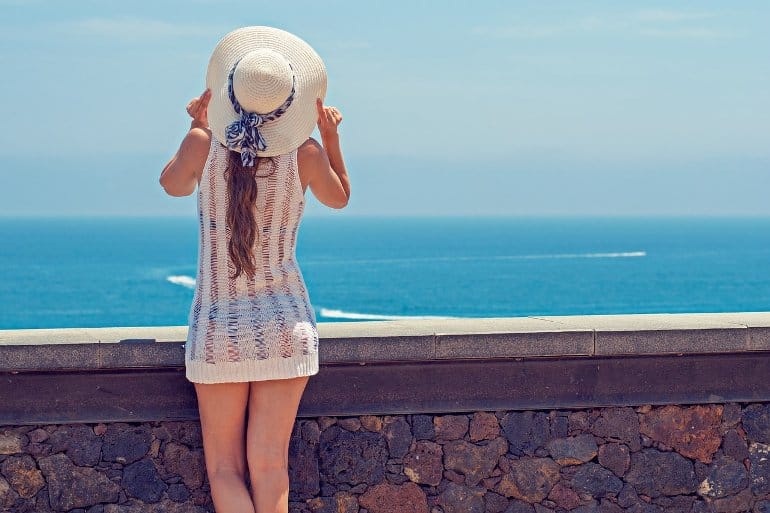 This shows a happy woman at a beach