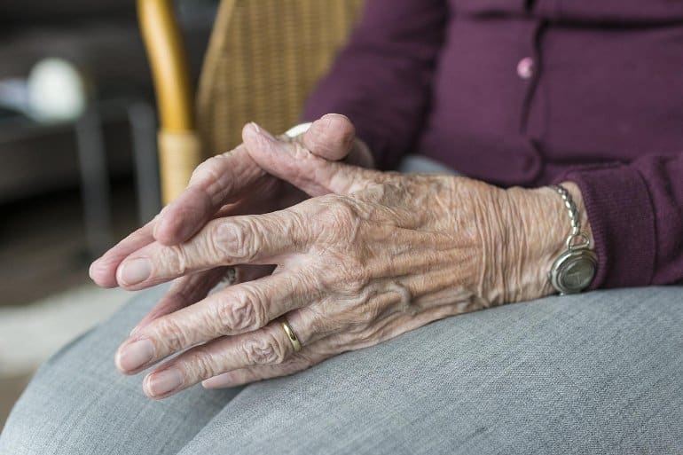 This shows an older lady's hands