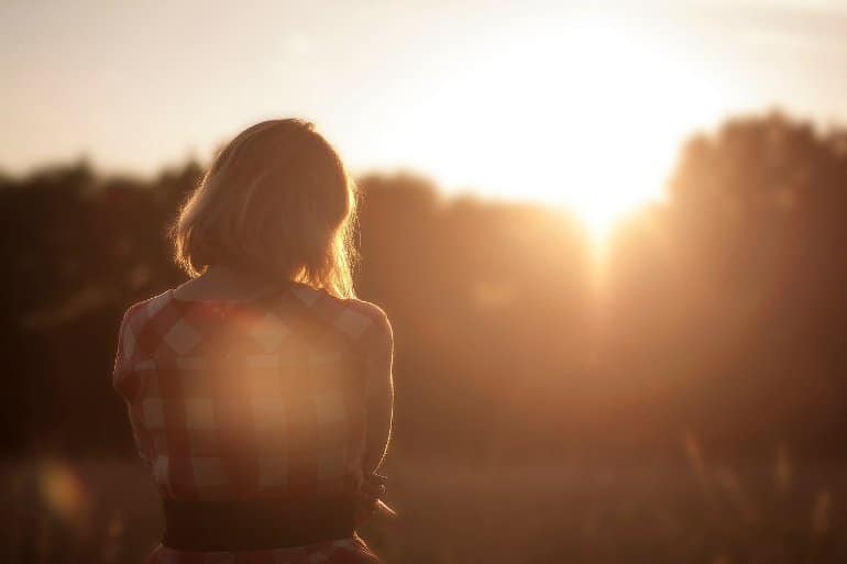 This shows a woman standing alone