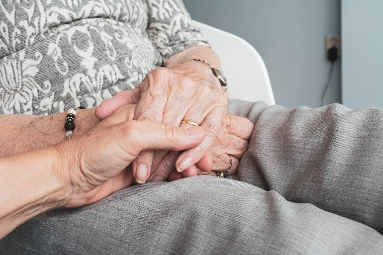 This shows an older lady's hands