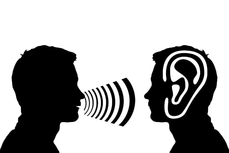 This illustration shows a person talking and a large ear