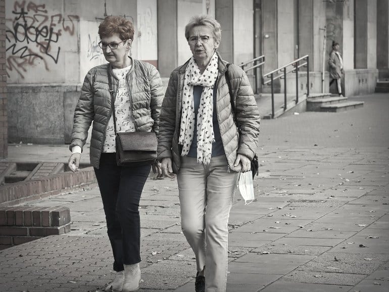 This shows two older ladies with face masks