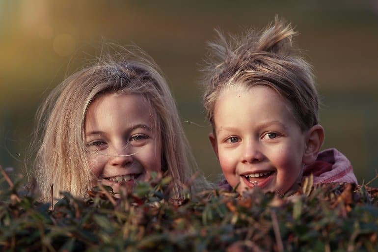 This shows a boy and girl playing outdoors