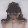 This shows a woman's back