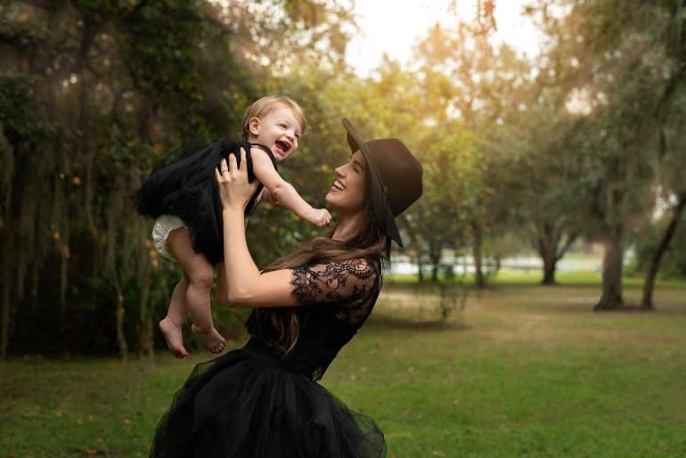 This shows a mom and a happy toddler