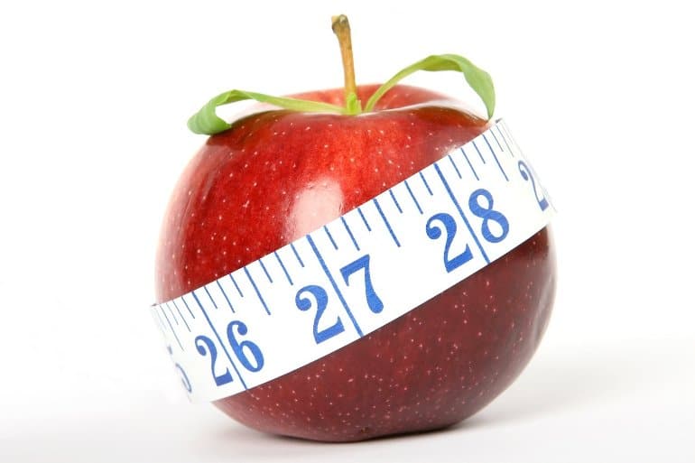 This shows an apple with a tape measure wrapped around it