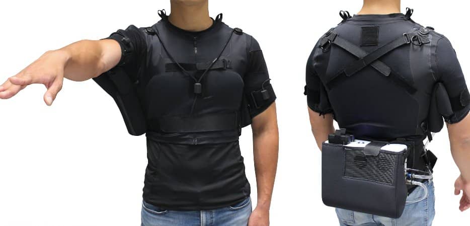 This shows a person demonstrating the vest with the robotic attachment