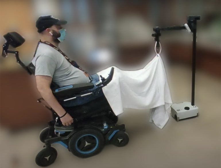 This shows a person in a wheelchair using the device