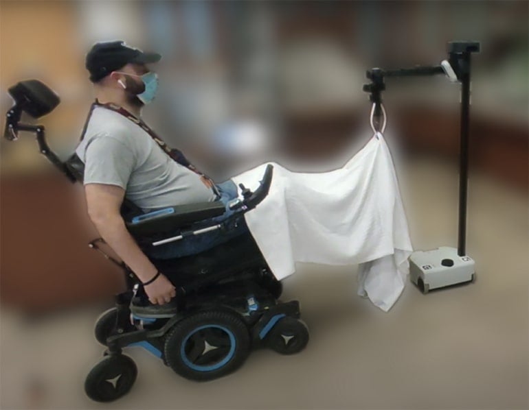 This shows a person in a wheelchair using the device