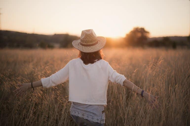 This shows a woman walking in a field