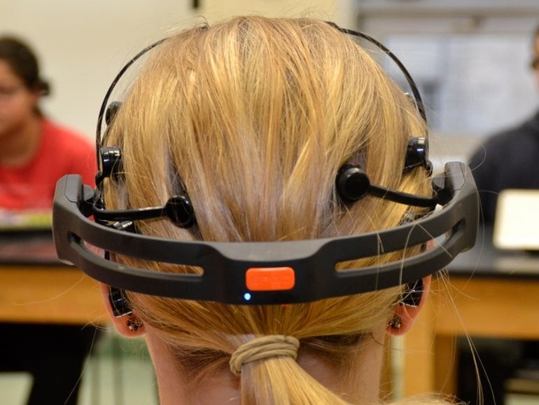 This shows a woman wearing an EEG