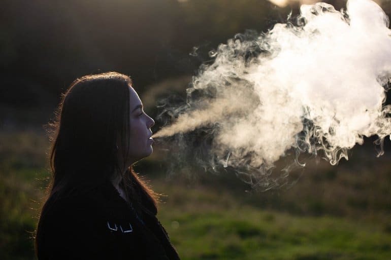 This shows a woman surrounded by smoke