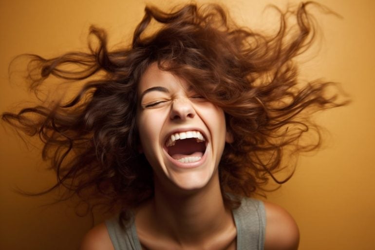 This shows a woman laughing.