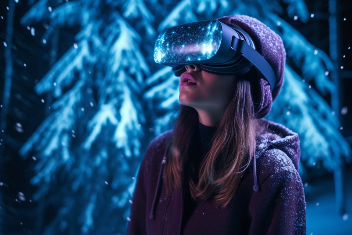 This shows a woman in VR goggles in a frosty forest.