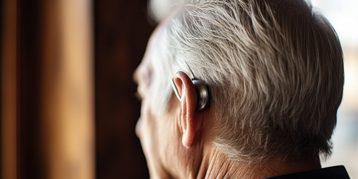 This shows a man wearing a hearing aid.