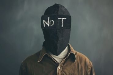 This shows a person with a blindfold that says Not.