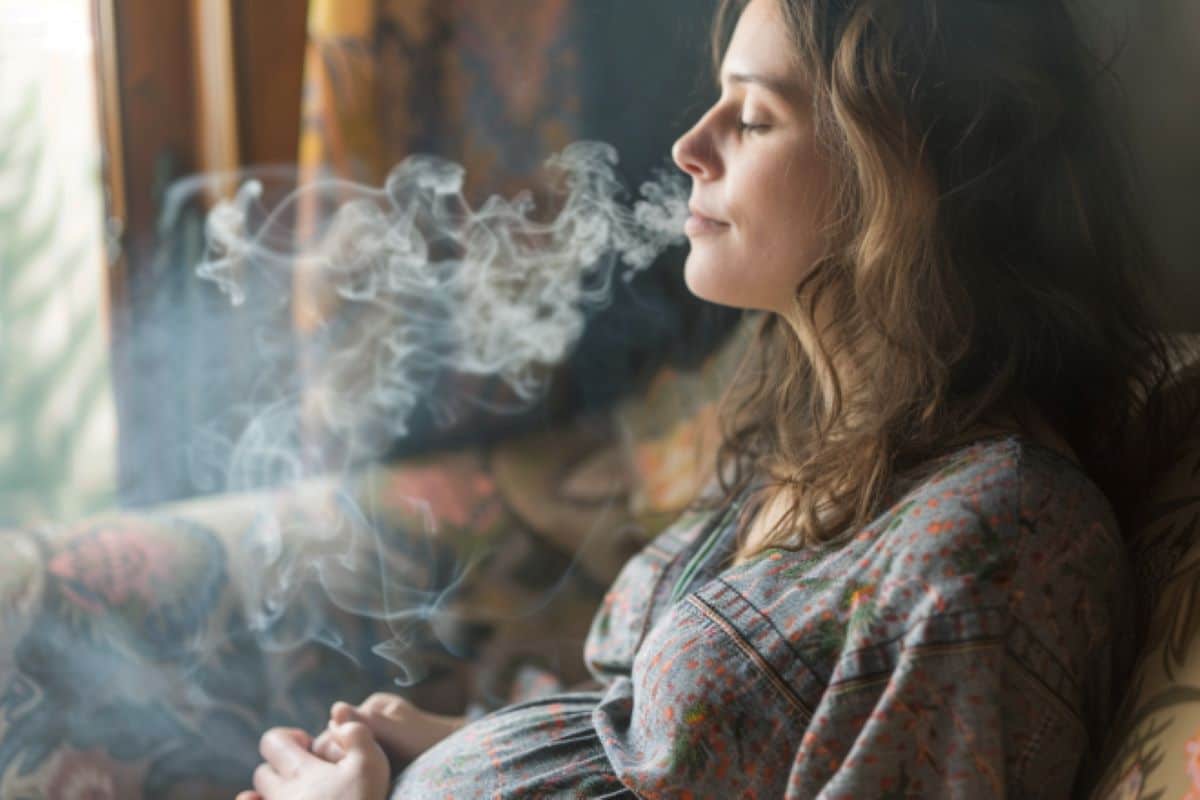 This shows a pregnant woman surrounded by smoke.