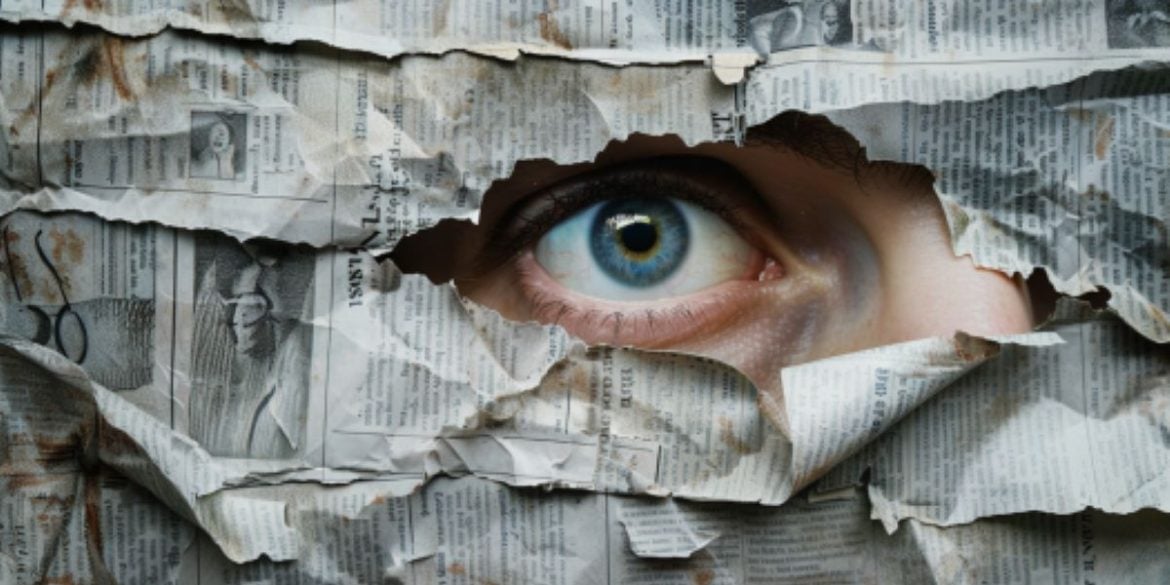 This shows a person looking through a newspaper.