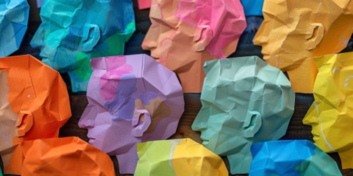 This shows colorful paper heads.