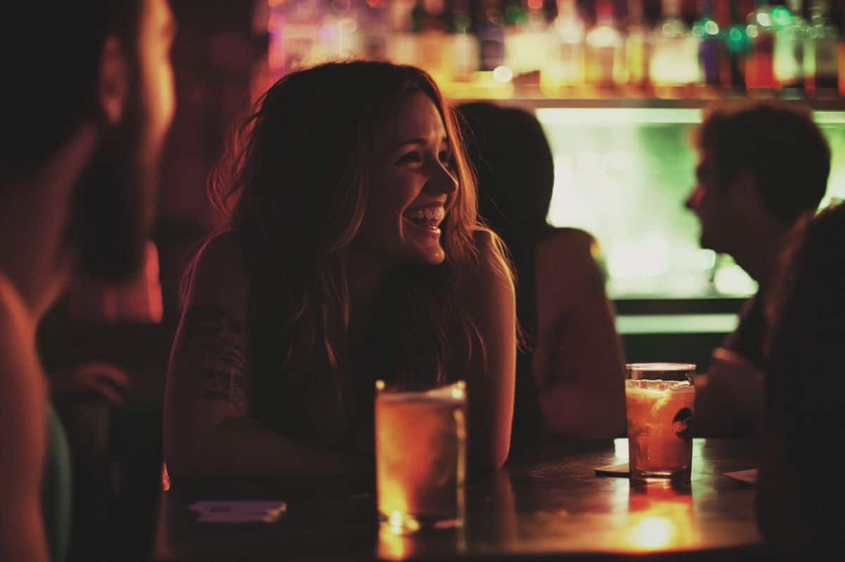 This shows a woman drinking with friends.