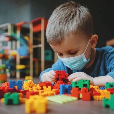 This shows a child playing with blocks.