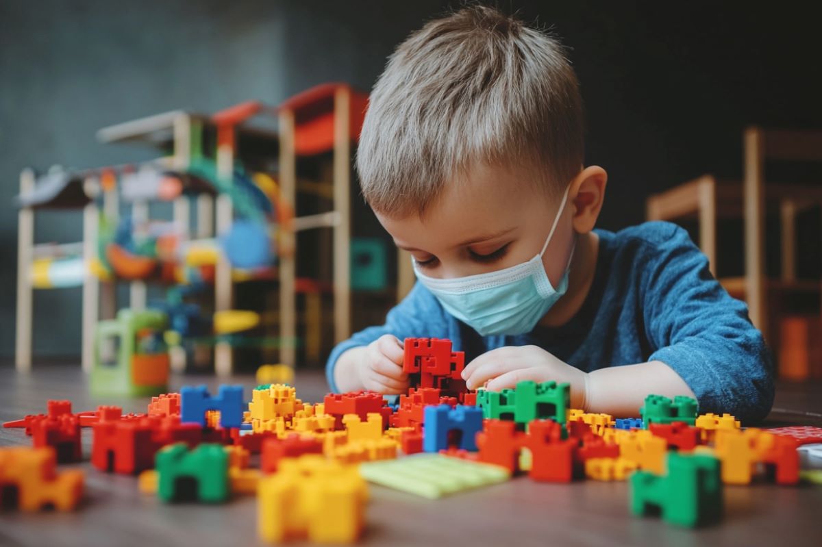 This shows a child playing with blocks.