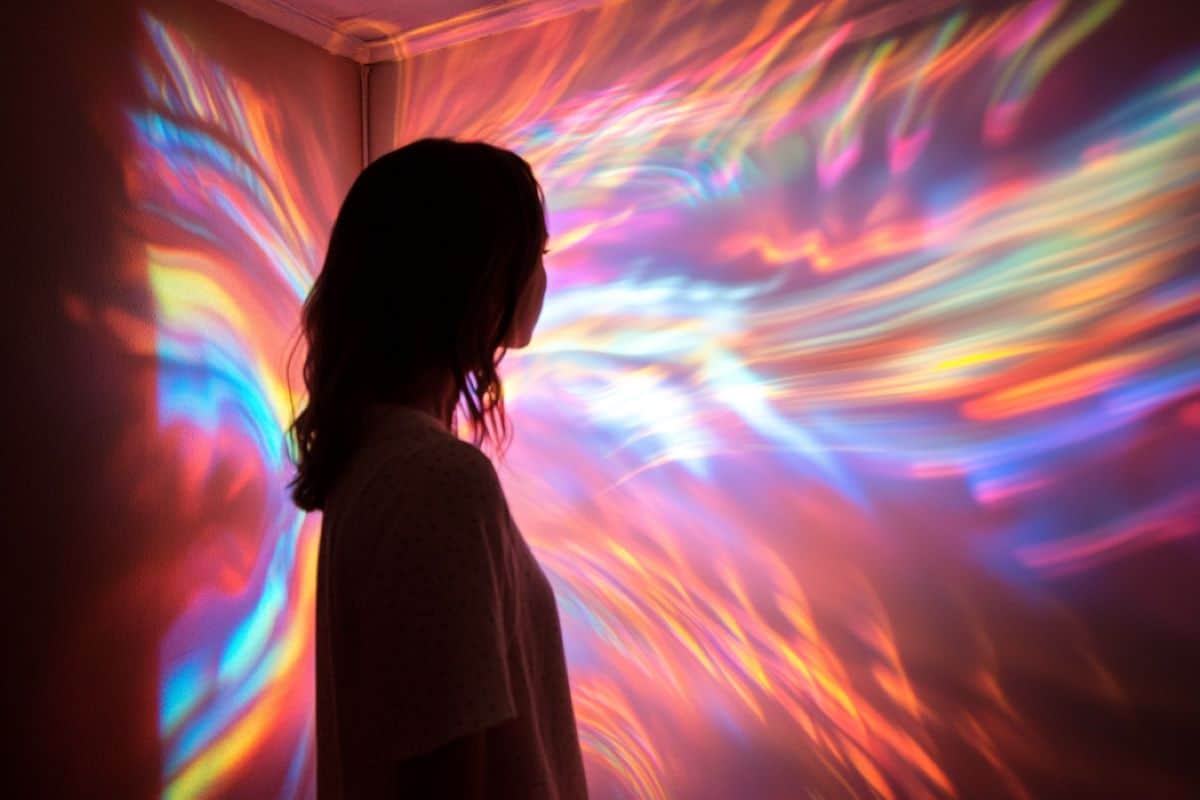 This shows a woman in a room of lights.