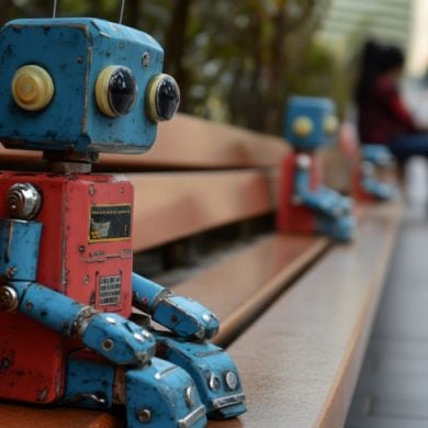 This shows a robot on a park bench.