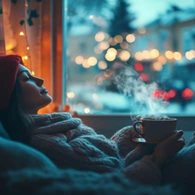 This shows a woman sitting alone with a mug of tea.