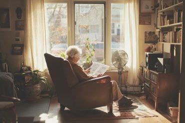 This shows an older woman doing a crossword.