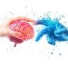 This shows a hand holding a brain and another reaching out to touch it.