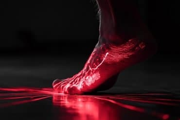 This shows a foot radiating red light, symbolizing pain.