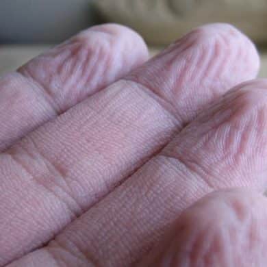 This shows wrinkled fingers.